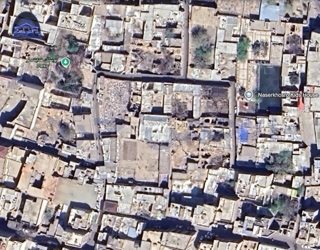 عکس هوایی از همان محدوده، اردیبهشت ۱۴۰۳ که نشان از تخریب تدریجی و قطع درختان در بافت ثبت ملی دارد.